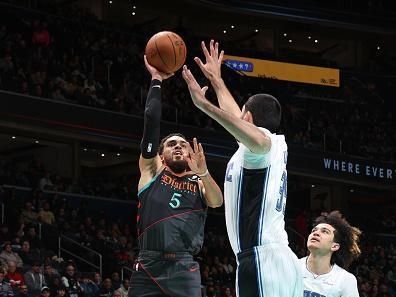 WASHINGTON, DC -? DECEMBER 26:  Tyus Jones #5 of the Washington Wizards goes to the basket during the game on December 26, 2023 at Capital One Arena in Washington, DC. NOTE TO USER: User expressly acknowledges and agrees that, by downloading and or using this Photograph, user is consenting to the terms and conditions of the Getty Images License Agreement. Mandatory Copyright Notice: Copyright 2023 NBAE (Photo by Stephen Gosling/NBAE via Getty Images)