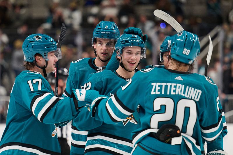 Apr 6, 2024; San Jose, California, USA; San Jose Sharks left wing William Eklund (72) is congratulated by his teammates after scoring a goal against the St. Louis Blues during the second period at SAP Center at San Jose. Mandatory Credit: Robert Edwards-USA TODAY Sports