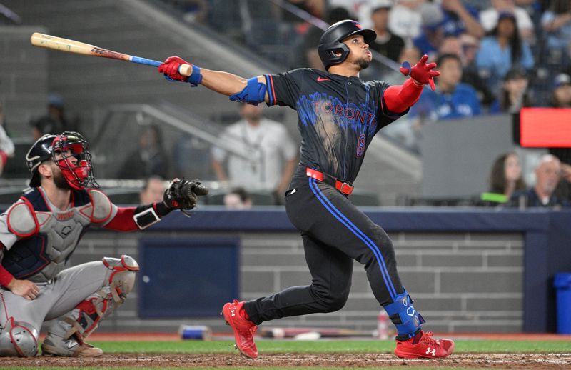 Sep 25, 2024; Toronto, Ontario, CAN;  Toronto Blue Jays center fielder Jonatan Clase (8) hits a two-run home run against the Boston Red Sox in the seventh inning at Rogers Centre. Mandatory Credit: Dan Hamilton-Imagn Images