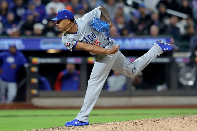 May 1, 2024; New York City, New York, USA; Chicago Cubs relief pitcher Yency Almonte (25) follows through on a pitch against the New York Mets during the eighth inning at Citi Field. Mandatory Credit: Brad Penner-USA TODAY Sports