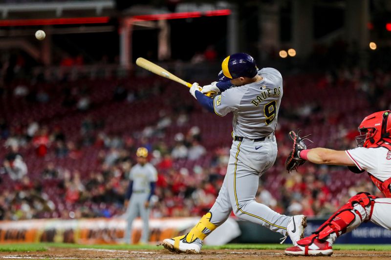 Apr 9, 2024; Cincinnati, Ohio, USA; Milwaukee Brewers first baseman Jake Bauers (9) hits a two-run double in the seventh inning against the Cincinnati Reds at Great American Ball Park. Mandatory Credit: Katie Stratman-USA TODAY Sports