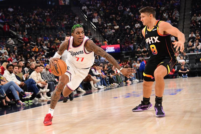 INGLEWOOD, CA - OCTOBER 31: Kevin Porter Jr. #77 of the LA Clippers dribbles the ball during the game against the Phoenix Suns on October 31, 2024 at Intuit Dome in Los Angeles, California. NOTE TO USER: User expressly acknowledges and agrees that, by downloading and/or using this Photograph, user is consenting to the terms and conditions of the Getty Images License Agreement. Mandatory Copyright Notice: Copyright 2024 NBAE (Photo by Adam Pantozzi/NBAE via Getty Images)