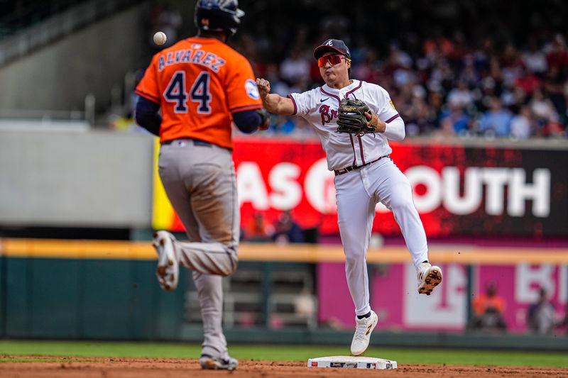 Sep 14, 2025; Cumberland, Georgia, USA; Atlanta Braves shortstop Ha-Seong Kim (9) throws for a double play after forcing out Houston Astros left fielder Yordan Alvarez (44) during the third inning at Truist Park. Mandatory Credit: Dale Zanine-Imagn Images