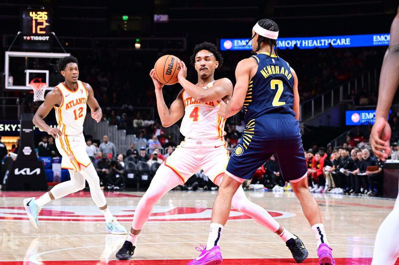 ATLANTA, GA - OCTOBER 8: Kobe Bufkin #4 of the Atlanta Hawks handles the ball during the game against the Indiana Pacers during a NBA preseason game on October 8, 2024 at State Farm Arena in Atlanta, Georgia.  NOTE TO USER: User expressly acknowledges and agrees that, by downloading and/or using this Photograph, user is consenting to the terms and conditions of the Getty Images License Agreement. Mandatory Copyright Notice: Copyright 2024 NBAE (Photo by Adam Hagy/NBAE via Getty Images)