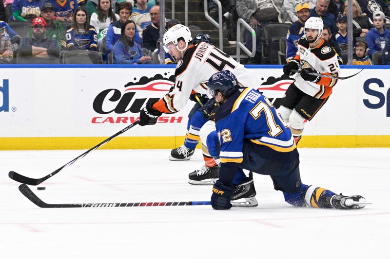 Mar 17, 2024; St. Louis, Missouri, USA; St. Louis Blues defenseman Justin Faulk (72) attempts to block a shot from Anaheim Ducks left wing Ross Johnston (44) during the third period at Enterprise Center. Mandatory Credit: Jeff Le-USA TODAY Sports