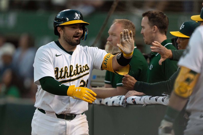 Jul 5, 2024; Oakland, California, USA;  Oakland Athletics catcher Shea Langeliers (23) celebrates after hitting a solo home run during the seventh inning against the Baltimore Orioles at Oakland-Alameda County Coliseum. Mandatory Credit: Stan Szeto-USA TODAY Sports