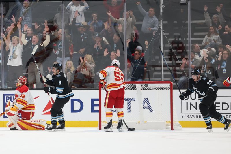 Oct 30, 2024; Salt Lake City, Utah, USA; Utah Hockey Club defenseman Ian Cole (28) celebrates a goal against the Calgary Flames during the first period at Delta Center. Mandatory Credit: Rob Gray-Imagn Images