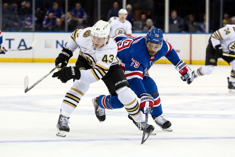 Nov 25, 2023; New York, New York, USA; New York Rangers defenseman K'Andre Miller (79) swats away the puck from Boston Bruins center Danton Heinen (43) during the third period at Madison Square Garden. Mandatory Credit: Danny Wild-USA TODAY Sports