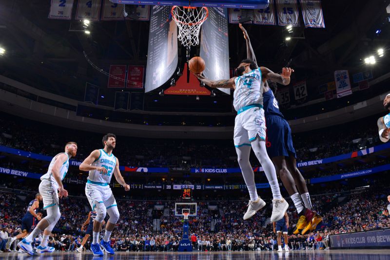 PHILADELPHIA, PA - MARCH 16: Nick Richards #4 of the Charlotte Hornets rebounds the ball during the game against the Philadelphia 76ers on March 16, 2024 at the Wells Fargo Center in Philadelphia, Pennsylvania NOTE TO USER: User expressly acknowledges and agrees that, by downloading and/or using this Photograph, user is consenting to the terms and conditions of the Getty Images License Agreement. Mandatory Copyright Notice: Copyright 2024 NBAE (Photo by Jesse D. Garrabrant/NBAE via Getty Images)