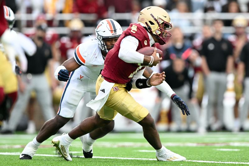 Sep 30, 2023; Chestnut Hill, Massachusetts, USA; Boston College Eagles quarterback Thomas Castellanos (1) is tackled by Virginia Cavaliers linebacker Kamren Robinson (5) during the first half at Alumni Stadium. Mandatory Credit: Brian Fluharty-USA TODAY Sports