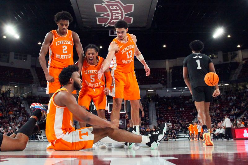 Jan 17, 2023; Starkville, Mississippi, USA; Tennessee Volunteers forward Julian Phillips (2), guard Zakai Zeigler (5), forward Olivier Nkamhoua (13) react with guard Josiah-Jordan James (30) during the second half against the Mississippi State Bulldogs at Humphrey Coliseum. Mandatory Credit: Petre Thomas-USA TODAY Sports