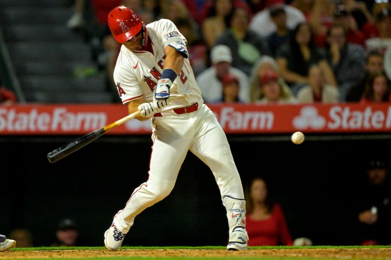 Apr 5, 2025; Anaheim, California, USA;  Los Angeles Angels center fielder Mike Trout (27) hits a two-run home run in the fifth inning against the Cleveland Guardians at Angel Stadium. Mandatory Credit: Jayne Kamin-Oncea-Imagn Images