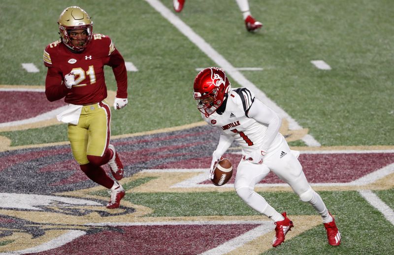 Nov 28, 2020; Chestnut Hill, Massachusetts, USA; Louisville Cardinals wide receiver Tutu Atwell (1) fumbles the ball while being pursued by Boston College Eagles defensive back Josh DeBerry (21) during the first half at Alumni Stadium. Mandatory Credit: Winslow Townson-USA TODAY Sports