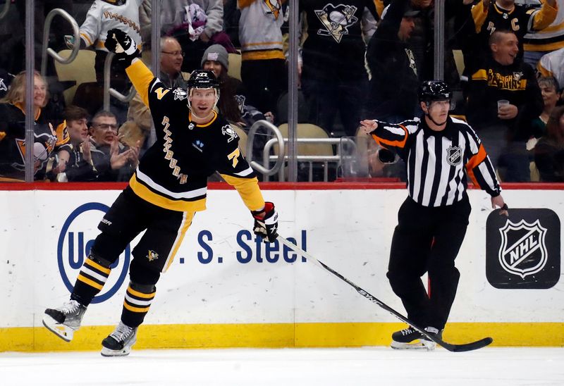 Apr 6, 2023; Pittsburgh, Pennsylvania, USA; Pittsburgh Penguins center Jeff Carter (77) celebrates after scoring a goal against the Minnesota Wild during the third period at PPG Paints Arena. Pittsburgh won 4-1. Mandatory Credit: Charles LeClaire-USA TODAY Sports