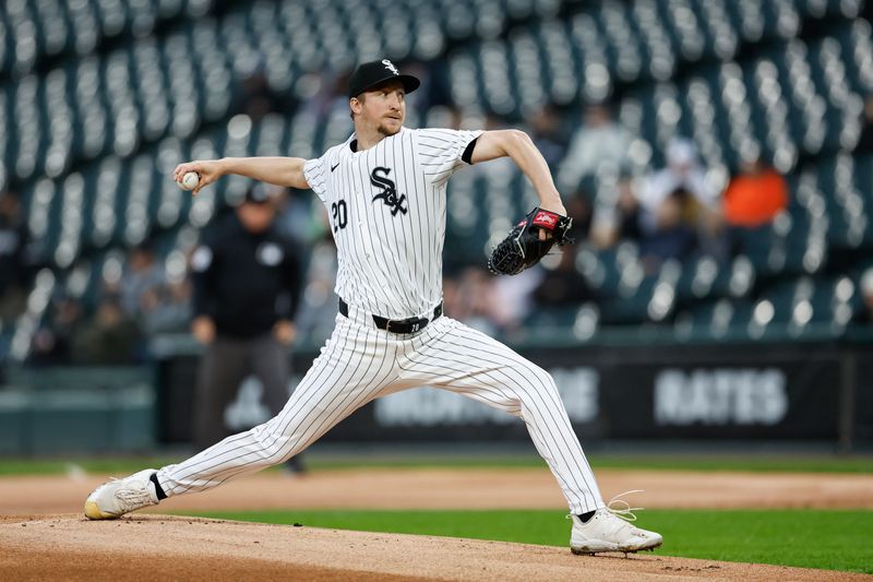 May 9, 2024; Chicago, Illinois, USA; Chicago White Sox starting pitcher Erick Fedde (20) delivers a pitch against the Cleveland Guardians during the first inning at Guaranteed Rate Field. Mandatory Credit: Kamil Krzaczynski-USA TODAY Sports