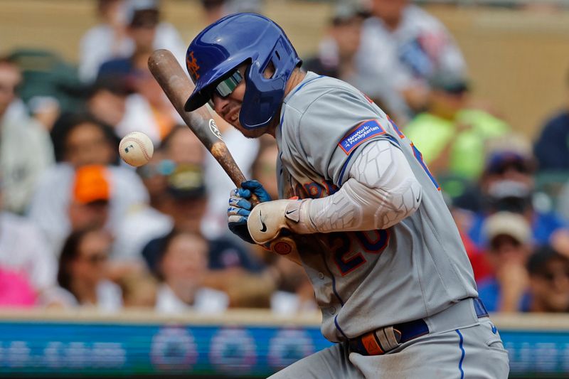 Sep 9, 2023; Minneapolis, Minnesota, USA; New York Mets first baseman Pete Alonso (20) reacts after getting hit by a pitch by the Minnesota Twins in the third inning at Target Field. Mandatory Credit: Bruce Kluckhohn-USA TODAY Sports