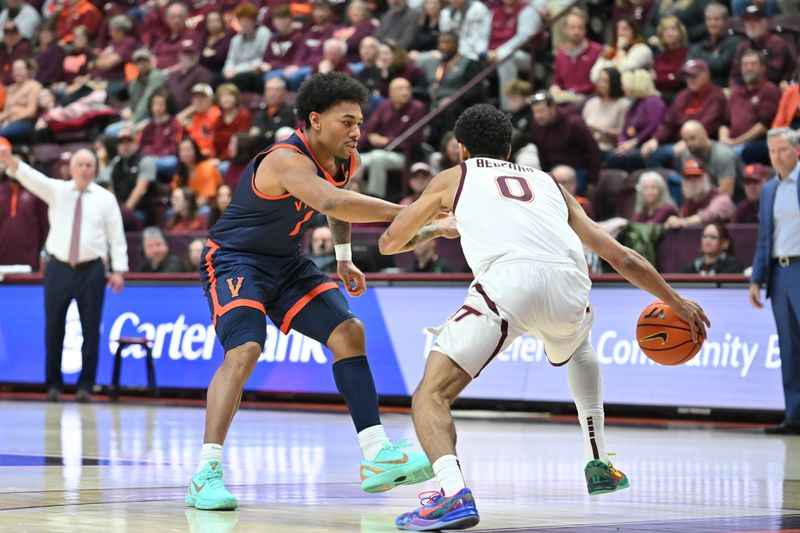 Dec 31, 2025; Blacksburg, Virginia, USA;   Virginia Tech Hokies guard Jailen Bedford (0) takes the ball down court as Virginia Cavaliers guard Malik Thomas (1) defends during the second half at Cassell Coliseum. Mandatory Credit: Brian Bishop-Imagn Images