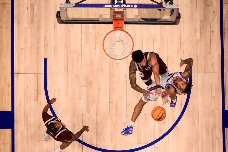 Mar 16, 2024; Nashville, TN, USA;  Florida Gators guard Will Richard (5) has his shot blocked by Texas A&M Aggies forward Andersson Garcia (11) at Bridgestone Arena. Mandatory Credit: Steve Roberts-USA TODAY Sports