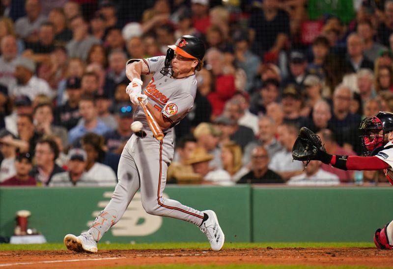 Sep 11, 2024; Boston, Massachusetts, USA; Baltimore Orioles second baseman Jackson Holliday (7) gets base hit against the Boston Red Sox in the seventh inning at Fenway Park. Mandatory Credit: David Butler II-Imagn Images