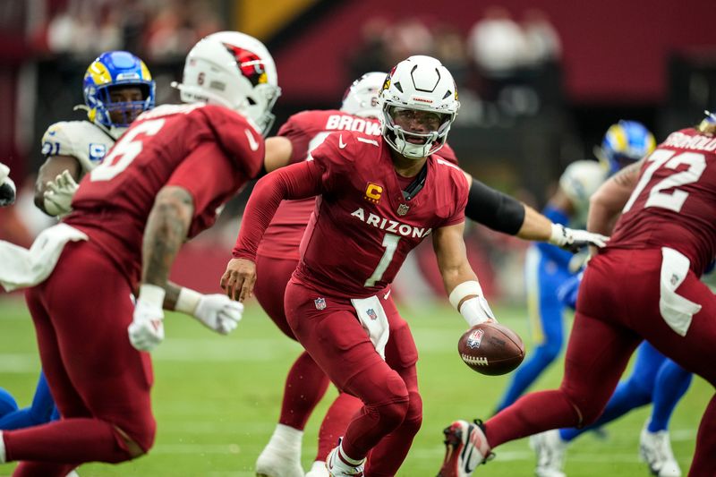 Arizona Cardinals quarterback Kyler Murray (1) works in the pocket against the Los Angeles Rams during the first half of an NFL football game, Sunday, Sept. 15, 2024, in Glendale, Ariz. (AP Photo/Ross D. Franklin)