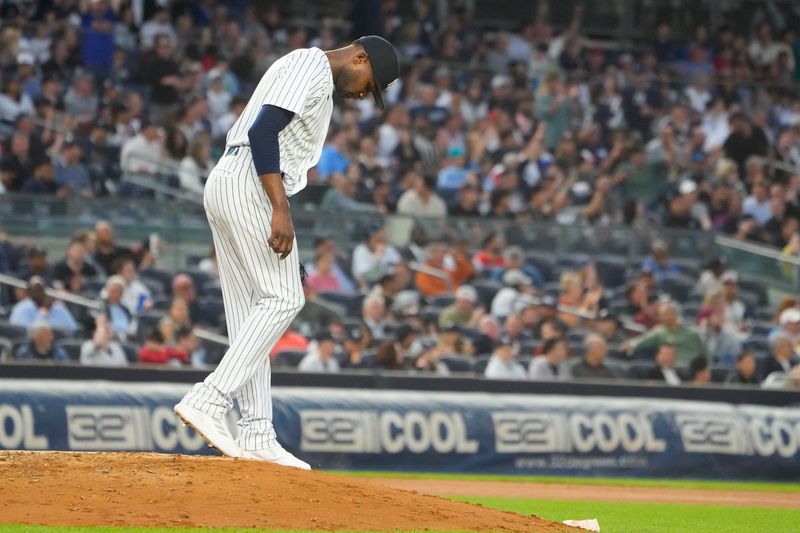 Jun 22, 2023; Bronx, New York, USA; New York Yankees pitcher Domingo German (0) looks at the ground after giving up a home run to Seattle Mariners right fielder Teoscar Hernandez (not pictured) during the fourth inning at Yankee Stadium. Mandatory Credit: Gregory Fisher-USA TODAY Sports