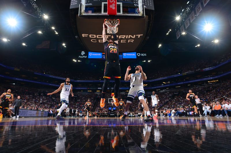 PHOENIX, AZ - APRIL  28: Jusuf Nurkic #20 of the Phoenix Suns dunks the ball during the game against the Minnesota Timberwolves during Round 1 Game 4 of the 2024 NBA Playoffs on April 28, 2024 at Footprint Center in Phoenix, Arizona. NOTE TO USER: User expressly acknowledges and agrees that, by downloading and or using this photograph, user is consenting to the terms and conditions of the Getty Images License Agreement. Mandatory Copyright Notice: Copyright 2024 NBAE (Photo by Kate Frese/NBAE via Getty Images)