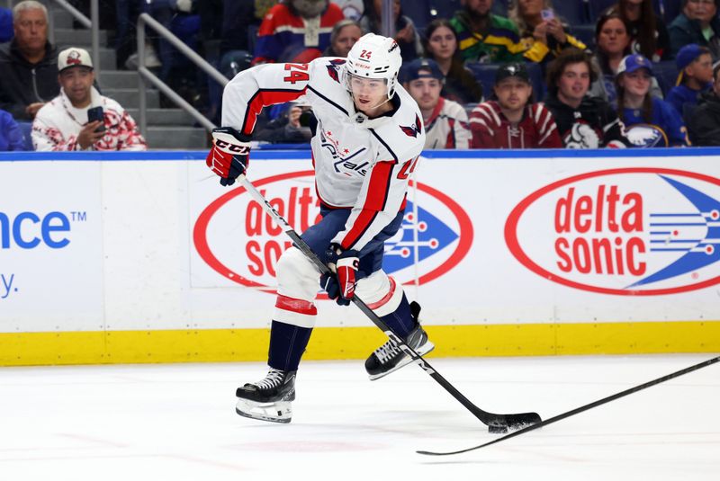 Apr 11, 2024; Buffalo, New York, USA;  Washington Capitals center Connor McMichael (24) takes a shot on goal during the first period against the Buffalo Sabres at KeyBank Center. Mandatory Credit: Timothy T. Ludwig-USA TODAY Sports