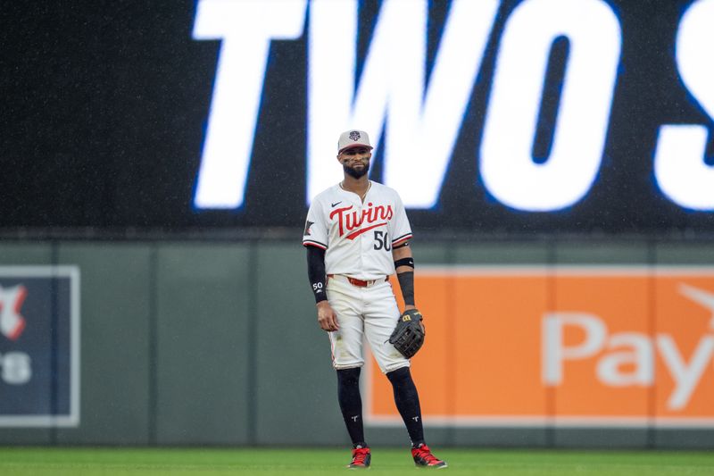 Jul 4, 2024; Minneapolis, Minnesota, USA; Minnesota Twins shortstop Willi Castro (50) awaits a pitch in the rain against the Detroit Tigers at Target Field. Mandatory Credit: Matt Blewett-USA TODAY Sports