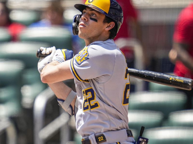 Jul 30, 2023; Cumberland, Georgia, USA; Milwaukee Brewers left fielder Christian Yelich (22) hits a home run against the Atlanta Braves during the third inning at Truist Park. Mandatory Credit: Dale Zanine-USA TODAY Sports