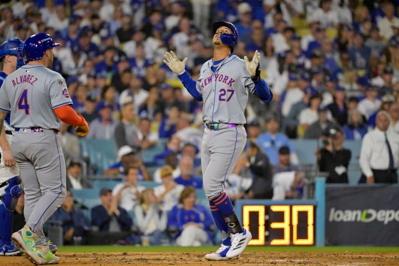 Oct 20, 2024; Los Angeles, California, USA; New York Mets third baseman Mark Vientos (27) celebrates after hitting a two run home run in the fourth inning against the Los Angeles Dodgers during game six of the NLCS for the 2024 MLB playoffs at Dodger Stadium. Mandatory Credit: Jayne Kamin-Oncea-Imagn Images