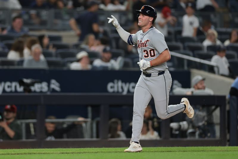 Sep 10, 2025; Bronx, New York, USA; Detroit Tigers right fielder Kerry Carpenter (30) hits a two run home run during the eighth inning against the New York Yankees at Yankee Stadium. Mandatory Credit: Vincent Carchietta-Imagn Images