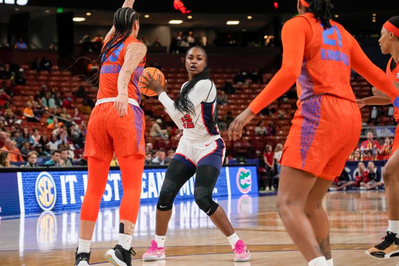 Mar 8, 2024; Greensville, SC, USA; Ole Miss Rebels forward Tyia Singleton (22) looks for a teammate guarded by Florida Gators guard Leilani Correa (23) during the first half at Bon Secours Wellness Arena. Mandatory Credit: Jim Dedmon-USA TODAY Sports