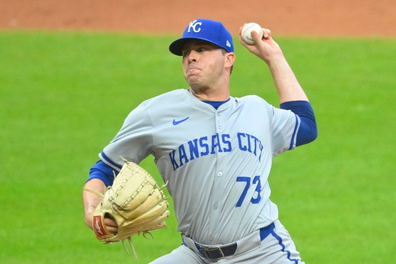 Jun 4, 2024; Cleveland, Ohio, USA; Kansas City Royals relief pitcher Sam Long (73) delivers a pitch in the seventh inning against the Cleveland Guardians at Progressive Field. Mandatory Credit: David Richard-USA TODAY Sports