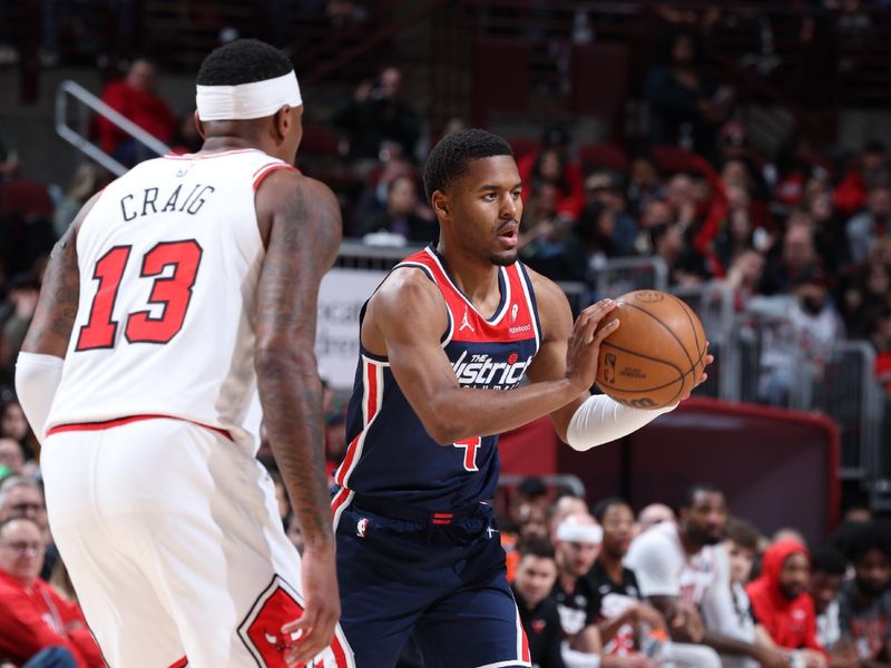 CHICAGO, IL - MARCH 16: Jared Butler #4 of the Washington Wizards looks to pass the ball during the game against the Chicago Bulls on March 16, 2024 at United Center in Chicago, Illinois. NOTE TO USER: User expressly acknowledges and agrees that, by downloading and or using this photograph, User is consenting to the terms and conditions of the Getty Images License Agreement. Mandatory Copyright Notice: Copyright 2024 NBAE (Photo by Jeff Haynes/NBAE via Getty Images)