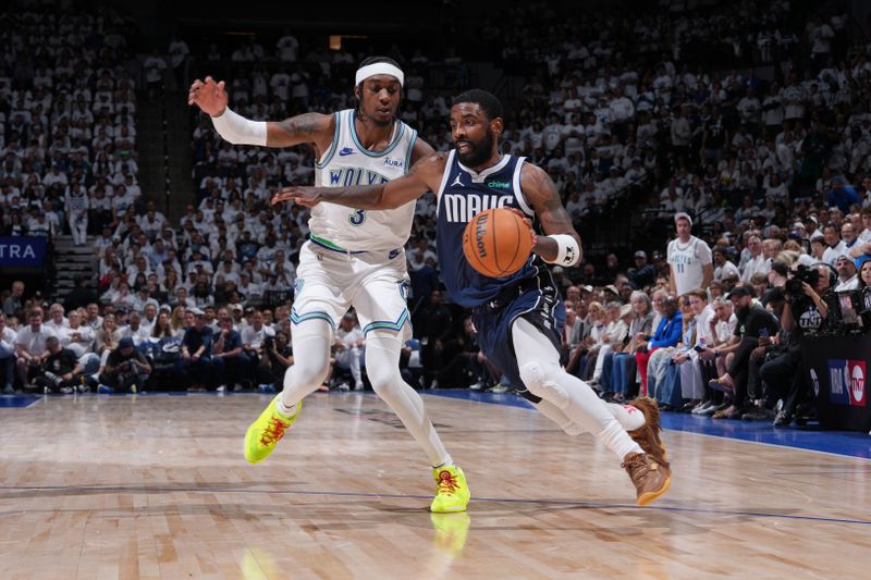 MINNEAPOLIS, MN - MAY 22: Kyrie Irving #11 of the Dallas Mavericks dribbles the ball during the game against the Minnesota Timberwolves during Game 1 of the Western Conference Finals of the 2024 NBA Playoffs on May 22, 2024 at Target Center in Minneapolis, Minnesota. NOTE TO USER: User expressly acknowledges and agrees that, by downloading and or using this Photograph, user is consenting to the terms and conditions of the Getty Images License Agreement. Mandatory Copyright Notice: Copyright 2024 NBAE (Photo by Jesse D. Garrabrant/NBAE via Getty Images)