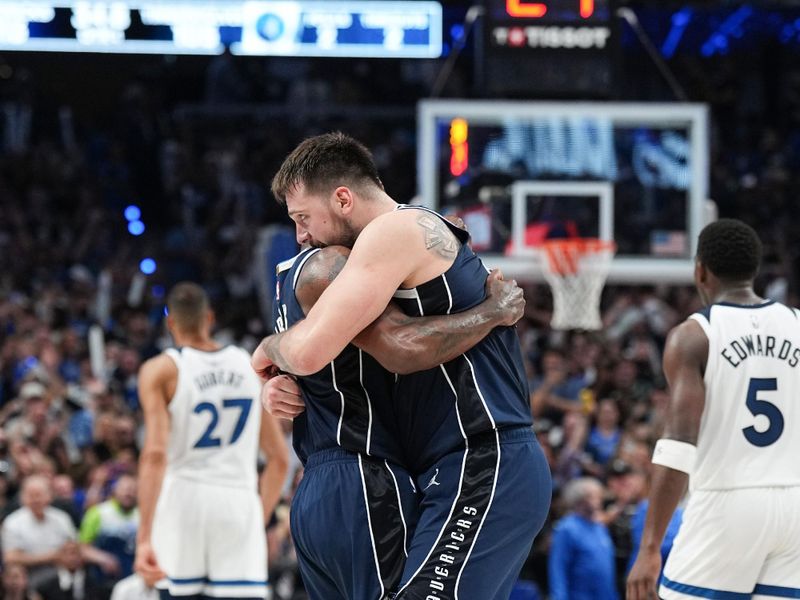 DALLAS, TX - MAY 26: Kyrie Irving #11 embraces Luka Doncic #77 of the Dallas Mavericks during the game against the Minnesota Timberwolves during Game 3 of the Western Conference Finals of the 2024 NBA Playoffs on May 26, 2024 at the American Airlines Center in Dallas, Texas. NOTE TO USER: User expressly acknowledges and agrees that, by downloading and or using this photograph, User is consenting to the terms and conditions of the Getty Images License Agreement. Mandatory Copyright Notice: Copyright 2024 NBAE (Photo by Glenn James/NBAE via Getty Images)