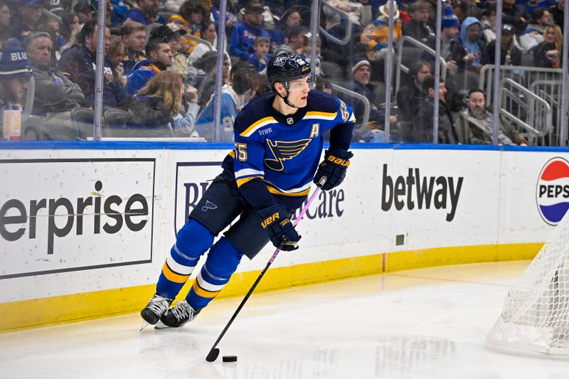 Jan 11, 2024; St. Louis, Missouri, USA;  St. Louis Blues defenseman Colton Parayko (55) controls the puck against the New York Rangers during the third period at Enterprise Center. Mandatory Credit: Jeff Curry-USA TODAY Sports