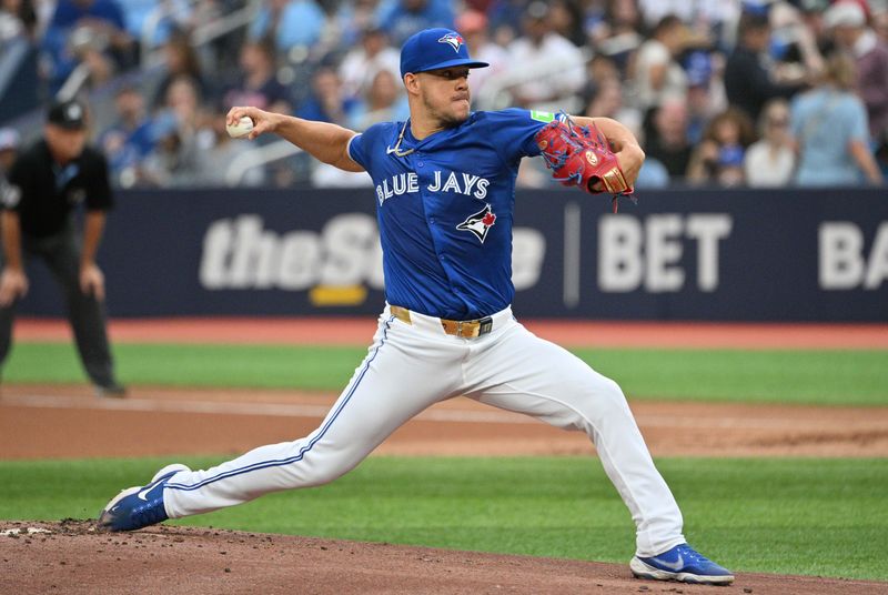 Jul 2, 2024; Toronto, Ontario, CAN;   Toronto Blue Jays starting pitcher Jose Berrios (17) delivers a pitch against the Houston Astros in the first inning at Rogers Centre. Mandatory Credit: Dan Hamilton-USA TODAY Sports