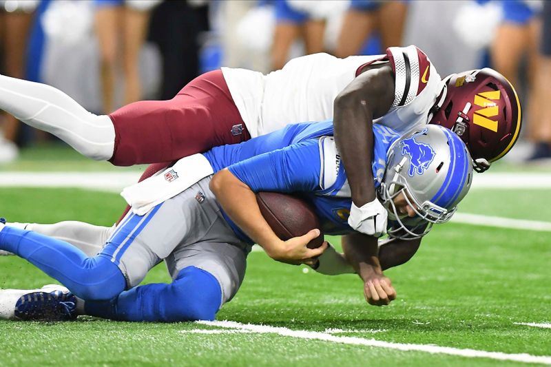 Detroit Lions quarterback Jared Goff (16) is sacked by Washington Commanders linebacker Jamin Davis (52) during the first half of an NFL football game Sunday, Sept. 18, 2022, in Detroit. (AP Photo/Lon Horwedel)