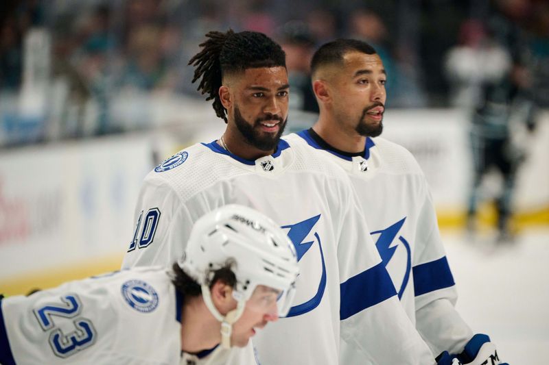 Mar 21, 2024; San Jose, California, USA; Tampa Bay Lightning left wing Anthony Duclair (10) warms up on the ice with center Michael Eyssimont (23) and defenseman Matt Dumba (24) before the game against the San Jose Sharks at SAP Center at San Jose. Mandatory Credit: Robert Edwards-USA TODAY Sports