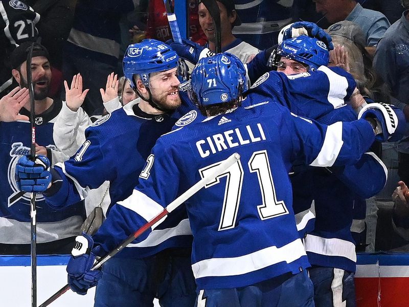 Mar 30, 2023; Tampa, Florida, USA; Members of the Tampa Bay Lightning celebrate a goal  in the third period against the Washington Capitals at Amalie Arena. Mandatory Credit: Jonathan Dyer-USA TODAY Sports