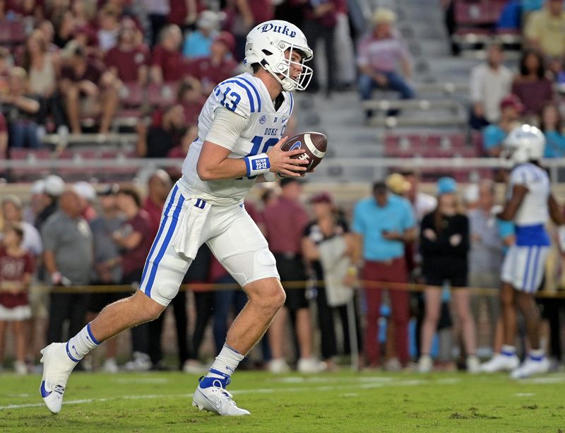 Oct 21, 2023; Tallahassee, Florida, USA; Duke Blue Devils quarterback Riley Leonard (13) warms up before the game against the Florida State Seminoles at Doak S. Campbell Stadium. Mandatory Credit: Melina Myers-USA TODAY Sports