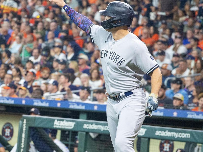 Sep 2, 2023; Houston, Texas, USA; New York Yankees designated hitter Giancarlo Stanton (27) celebrates his run against the Houston Astros in the second inning at Minute Maid Park. Mandatory Credit: Thomas Shea-USA TODAY Sports