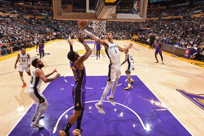 LOS ANGELES, CA - FEBRUARY 23: Victor Wembanyama #1 of the San Antonio Spurs rebounds during the game against the Los Angeles Lakers on Feburary 23, 2024 at Crypto.Com Arena in Los Angeles, California. NOTE TO USER: User expressly acknowledges and agrees that, by downloading and/or using this Photograph, user is consenting to the terms and conditions of the Getty Images License Agreement. Mandatory Copyright Notice: Copyright 2024 NBAE (Photo by Andrew D. Bernstein/NBAE via Getty Images)