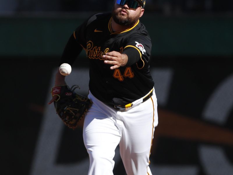 Jun 8, 2024; Pittsburgh, Pennsylvania, USA;  Pittsburgh Pirates first baseman Rowdy Tellez (44) flips the ball to first base to record an out against the Minnesota Twins during the fifth inning at PNC Park. Pittsburgh won 4-0. Mandatory Credit: Charles LeClaire-USA TODAY Sports