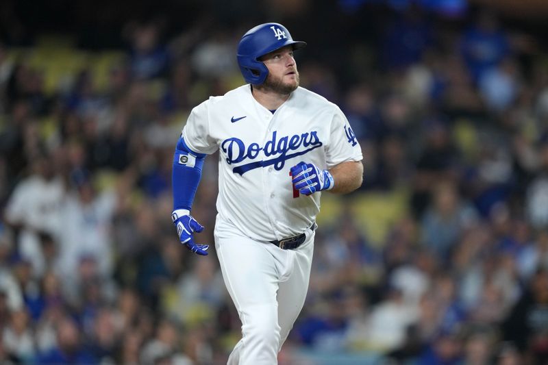 Sep 20, 2023; Los Angeles, California, USA; Los Angeles Dodgers third baseman Max Muncy (13) runs the bases after hitting a home run in the sixth inning against the Detroit Tigers at Dodger Stadium. Mandatory Credit: Kirby Lee-USA TODAY Sports