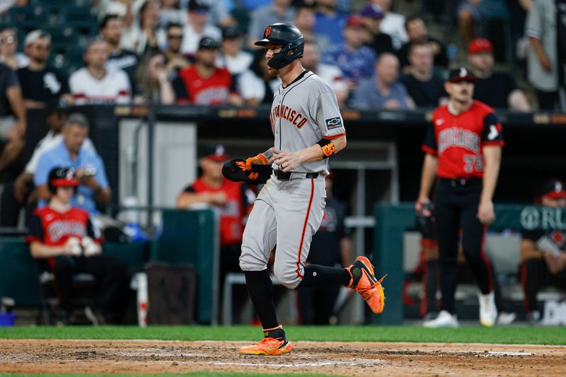 Jun 27, 2025; Chicago, Illinois, USA; San Francisco Giants third baseman Christian Koss (50) scores against the Chicago White Sox during the sixth inning at Rate Field. Mandatory Credit: Kamil Krzaczynski-Imagn Images