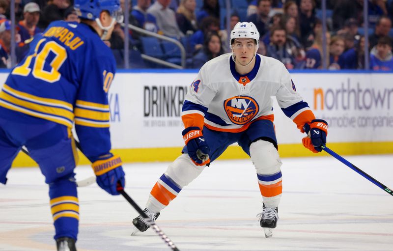 Mar 14, 2024; Buffalo, New York, USA;  New York Islanders center Jean-Gabriel Pageau (44) watches as Buffalo Sabres defenseman Henri Jokiharju (10) looks to make a pass during the first period at KeyBank Center. Mandatory Credit: Timothy T. Ludwig-USA TODAY Sports