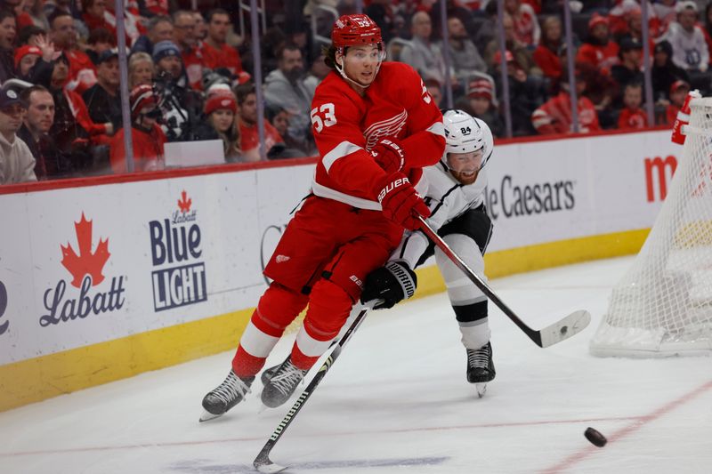 Jan 13, 2024; Detroit, Michigan, USA;  Detroit Red Wings defenseman Moritz Seider (53) skates with the puck chased by Los Angeles Kings defenseman Vladislav Gavrikov (84) in the third period at Little Caesars Arena. Mandatory Credit: Rick Osentoski-USA TODAY Sports