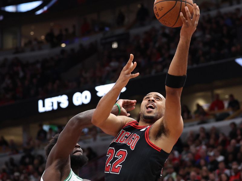 CHICAGO, ILLINOIS - NOVEMBER 29: Talen Horton-Tucker #22 of the Chicago Bulls shoots the ball against Neemias Queta #88 of the Boston Celtics during the fourth quarter of the Emirates NBA Cup game at the United Center on November 29, 2024 in Chicago, Illinois. NOTE TO USER: User expressly acknowledges and agrees that, by downloading and or using this photograph, User is consenting to the terms and conditions of the Getty Images License Agreement.  (Photo by Luke Hales/Getty Images)